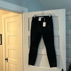 Coated black jeans